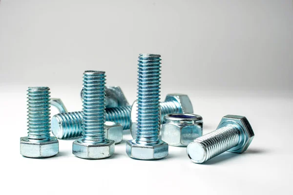 Group Bolts Nuts Made Light Metal White Background — Stock Photo, Image