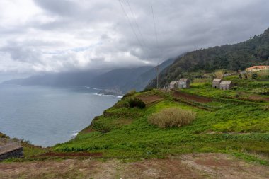 View of green mountains and Atlantic coast of Madeira in Miradouro da Eira da Achada
