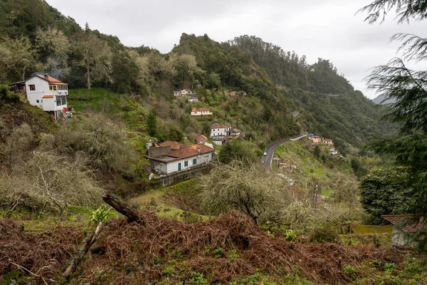 Green mountains and old houses in Ribeiro Frio, Madeira, Portugal