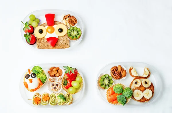 school lunch box for kids with food in the form of funny faces