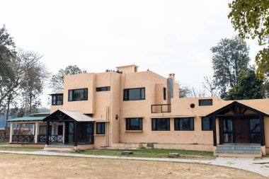 Jim Corbett, Uttarakhand, India - March 2021 : Architecture view of forest rest houses in Jim Corbett national park Dhikala zone for tourists to stay during their jungle trip. clipart