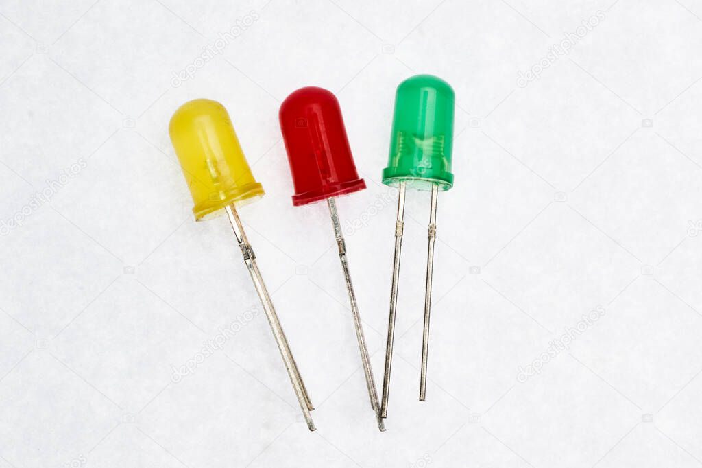 Yellow, orange and green light emitter diodes (LED) with white background