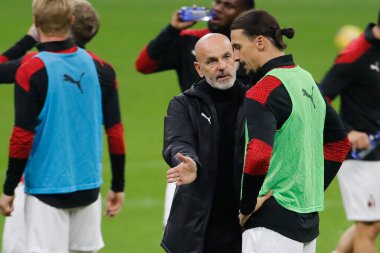  08/11/2020. Milan-Verona. Stefano Pioli, coach Milan, talking with Zlatan Ibrahimovic during warmup. 