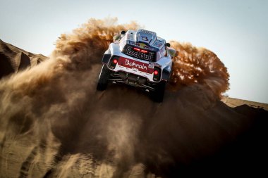 SAUDI ARABIA -  5TH-17TH JANUARY, 2020: 42nd Dakar Rally from Jeddah to Riyad. Stephane Peterhansel, France, Mini. clipart