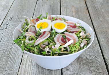 Dandelion salad with eggs and bacon clipart