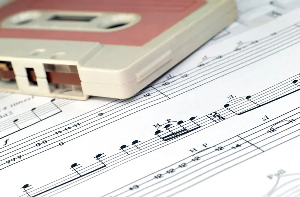 Old cassette and music notes — Stock Photo, Image