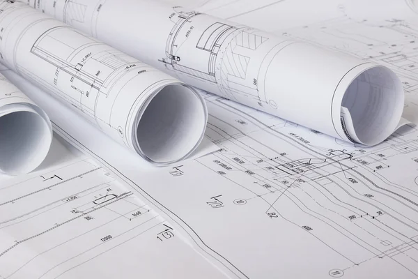 Architectural blueprints and blueprint rolls Stock Photo