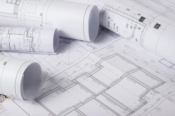 Architectural blueprints and blueprint rolls Royalty Free Stock Images