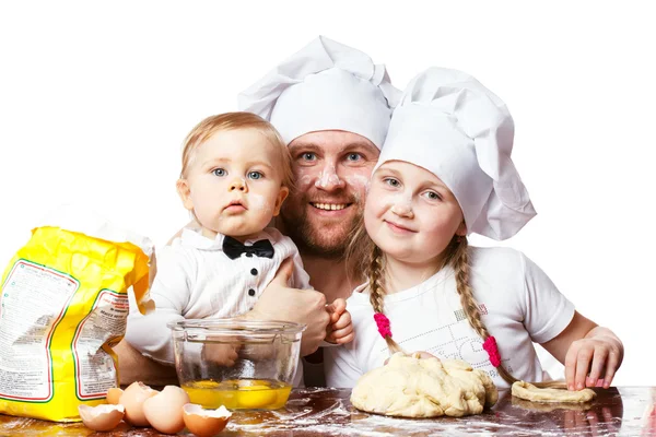 Father with daughter and son cooking in the kitchen — Stock Photo, Image