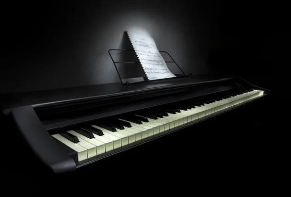 Piano met muziek van het blad — Stockfoto