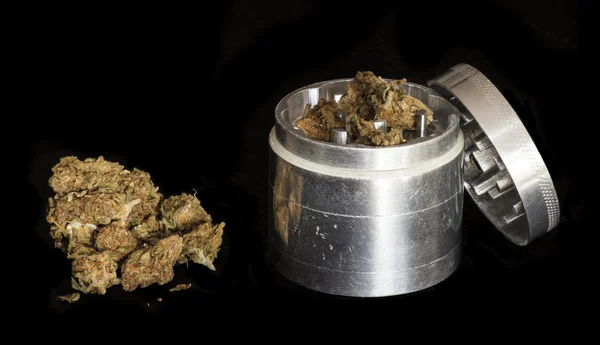 Marijuana and metal grinder — Stock Photo, Image