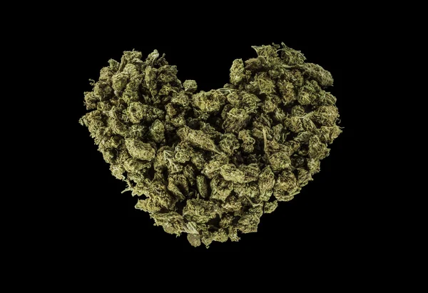 Green heart made of marijuana — Stock Photo, Image