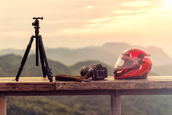 Travel photographer equipment with beautiful landscape