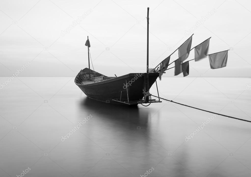 The fishing boat in black and white at Kon Ao Beach, Rayong, Tha