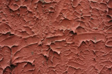 arka plan kırmızı sıva duvar yüzeyine yakın çekim.