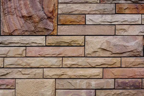 Areia parede de tijolos de pedra para fundo . — Fotografia de Stock