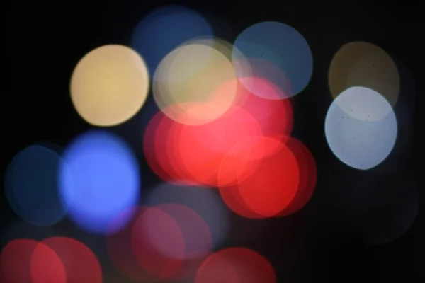 Multicolored city lights blurred bokeh background — Stock Photo, Image