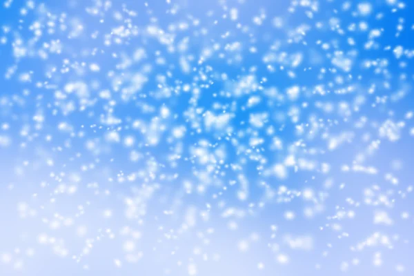 Abstract background of blurred snow storm on blue sky. — Stock Photo, Image