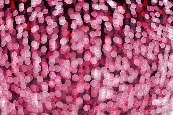 Defocused abstract pink light bokeh and christmas tree backgroun — Stock Photo, Image