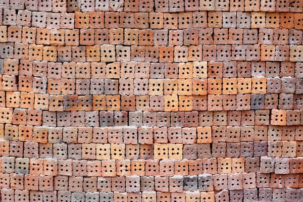 Stack of clay bricks texture background. — Stock Photo, Image