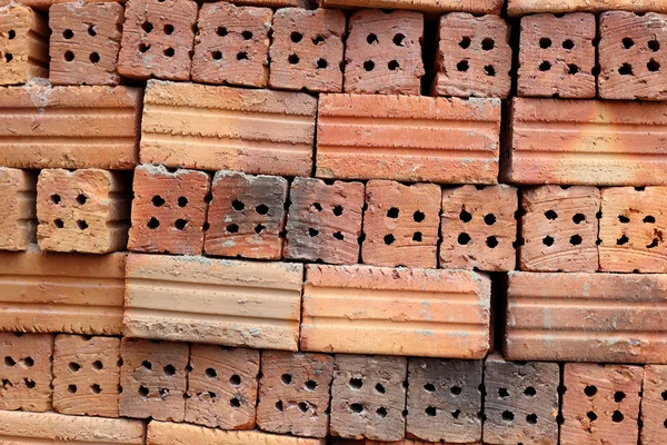 Stack of clay bricks texture background. — Stock Photo, Image