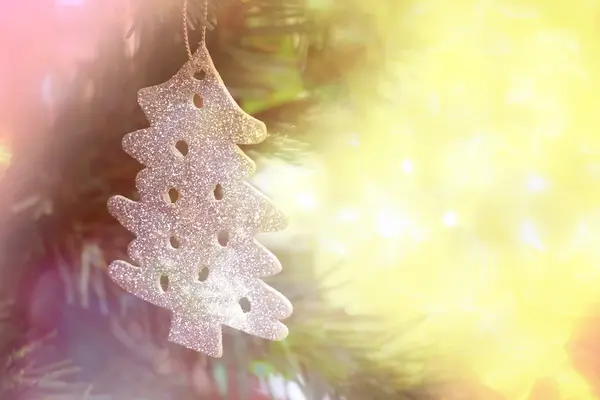 Christmas decorations hanging on christmas tree with light bokeh — Stock Photo, Image