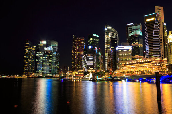 Singapore cityscape at night with reflect