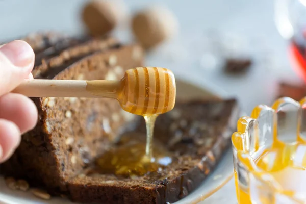 The holiday of honey saved. On the table are honey, black bread, tea.