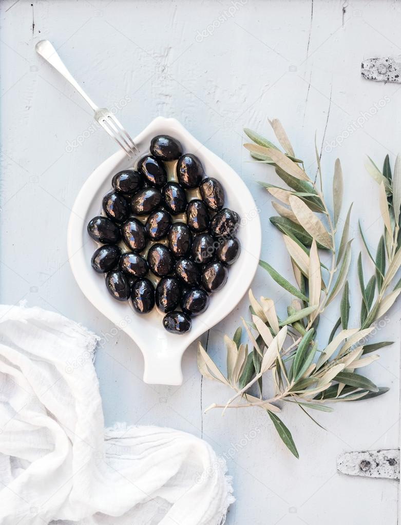 Black olives in white plate