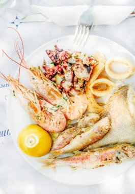 Cooked seafood on plate clipart