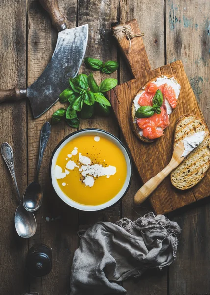 Dinner or lunch with pumpkin cream soup and toasts — Stock Image Dinner or lunch with pumpkin cream soup and toasts Stock Image