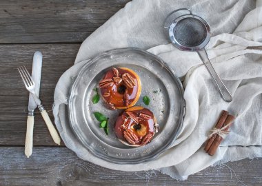 Cinnamon donuts with caramel icing and pekans served with fresh clipart