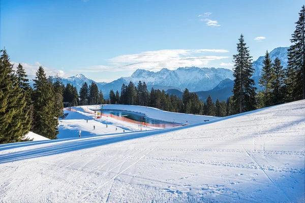 Mountain skiing slopes at Hausberg top — Stock Photo, Image