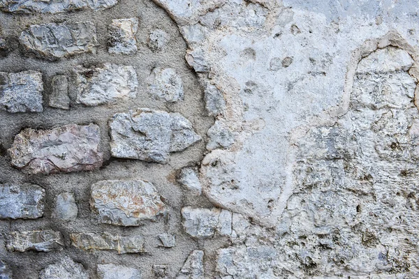 Old rough grey stone wall texture — Stock Photo, Image