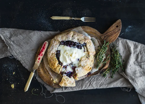 Homemade crusty blueberry pie or galette with ice-cream Royalty Free Stock Photos