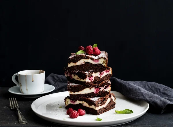 Brownies-cheesecake tower with raspberries on white ceramic plate — Stock Photo, Image