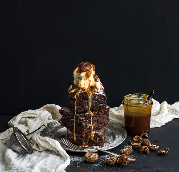 Fudgy Brownies tower with salted caramel, walnuts and ice-cream — Stock Photo, Image