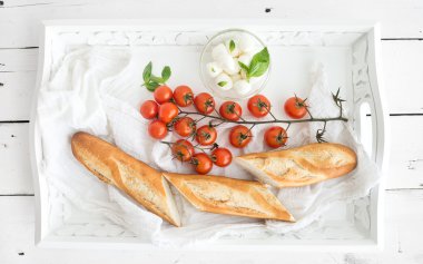 Baguette with branch of cherry-tomatoes
