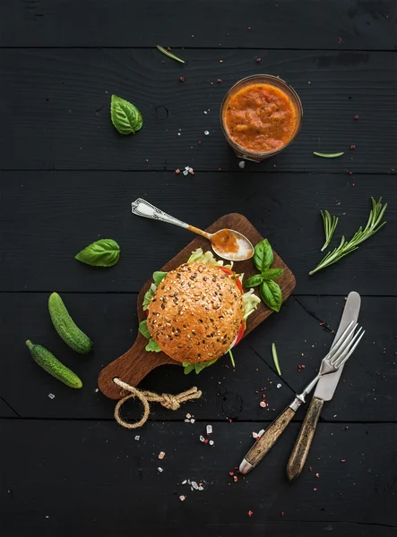 Fresh homemade burger on dark — Stock Photo, Image