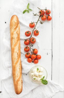 Baguette with banch of cherry-tomatoes clipart