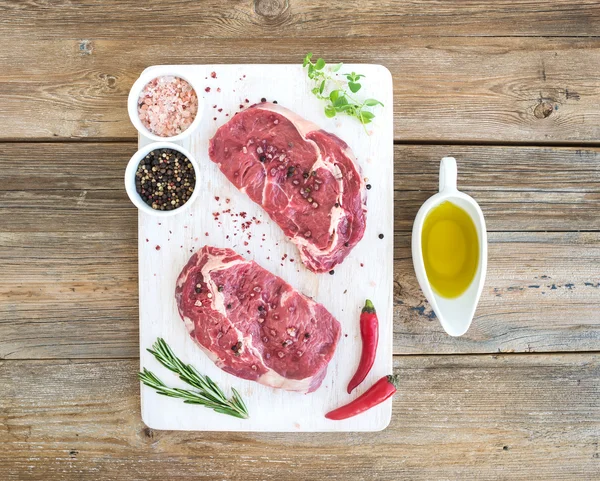 Ribeye steak entrecote and seasonings — Zdjęcie stockowe
