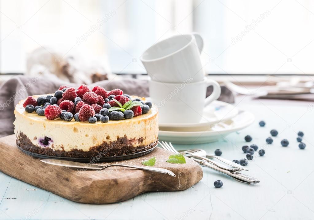 Cheesecake with fresh raspberries and blueberries