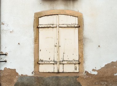French window with closed  shutters