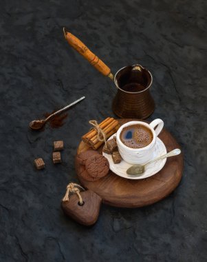 Cup of black coffee with chocolate biscuits