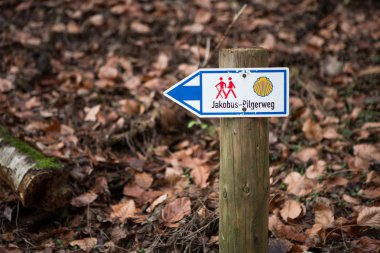 Waymarking on the Camino de Santiago, long distance pilgrimage, Europe, mountains intentionally out of focus clipart