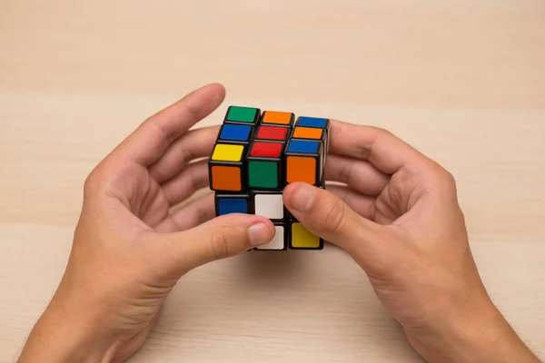 Hand Holds Colored Puzzle Rubik Cube Three Three Lies Wooden — Stock Photo, Image