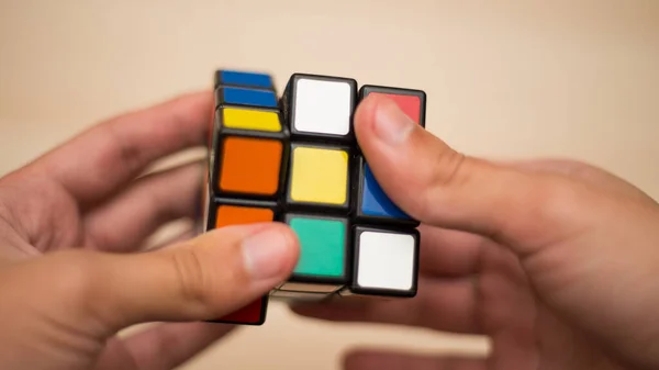 Hand Holds Colored Puzzle Rubik Cube Three Three Lies Wooden — Stock Photo, Image