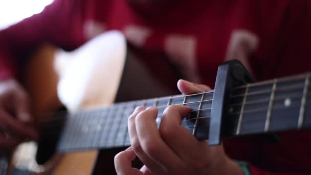 Man Red Sweater Plays Acoustic Guitar Indoors Close View Wide — Stock Video