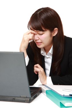 young Japanese businesswoman suffers from Asthenopia clipart