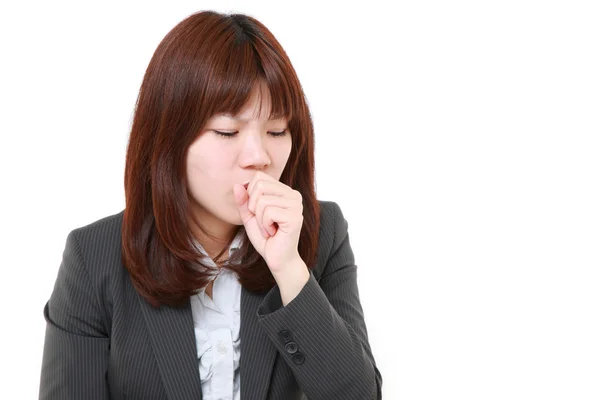 Retrato de una joven empresaria japonesa tosiendo — Foto de Stock